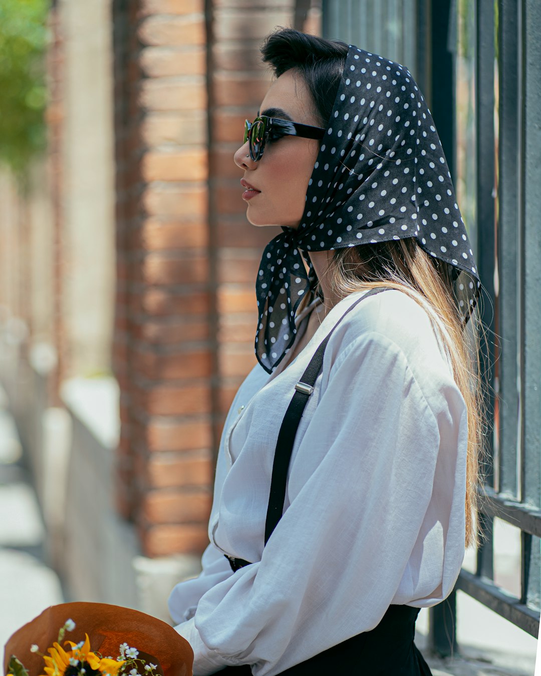 woman in white long sleeve shirt wearing black sunglasses