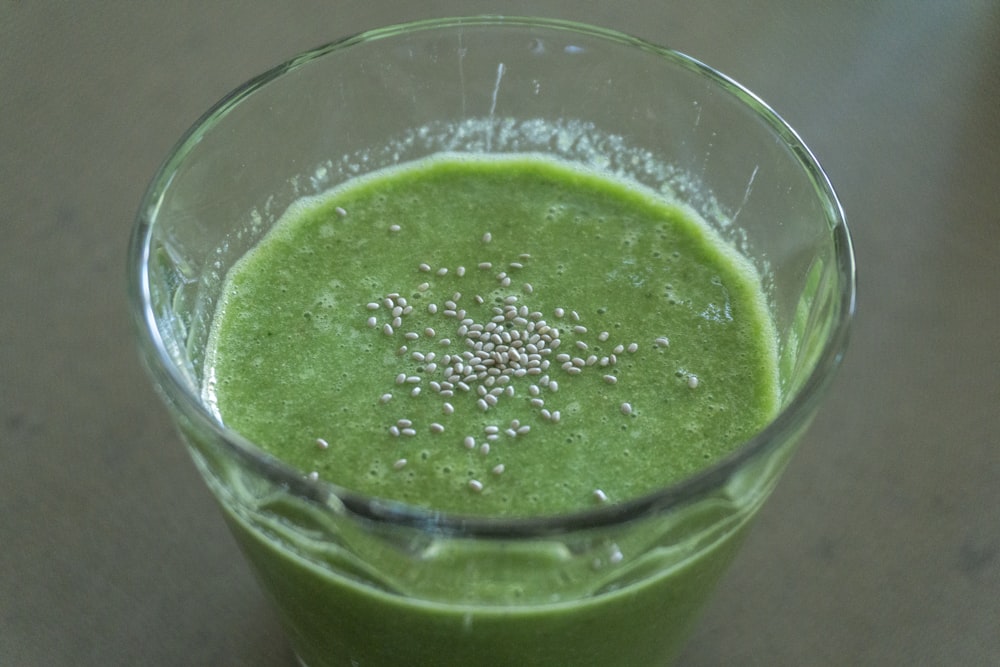 green liquid in clear drinking glass