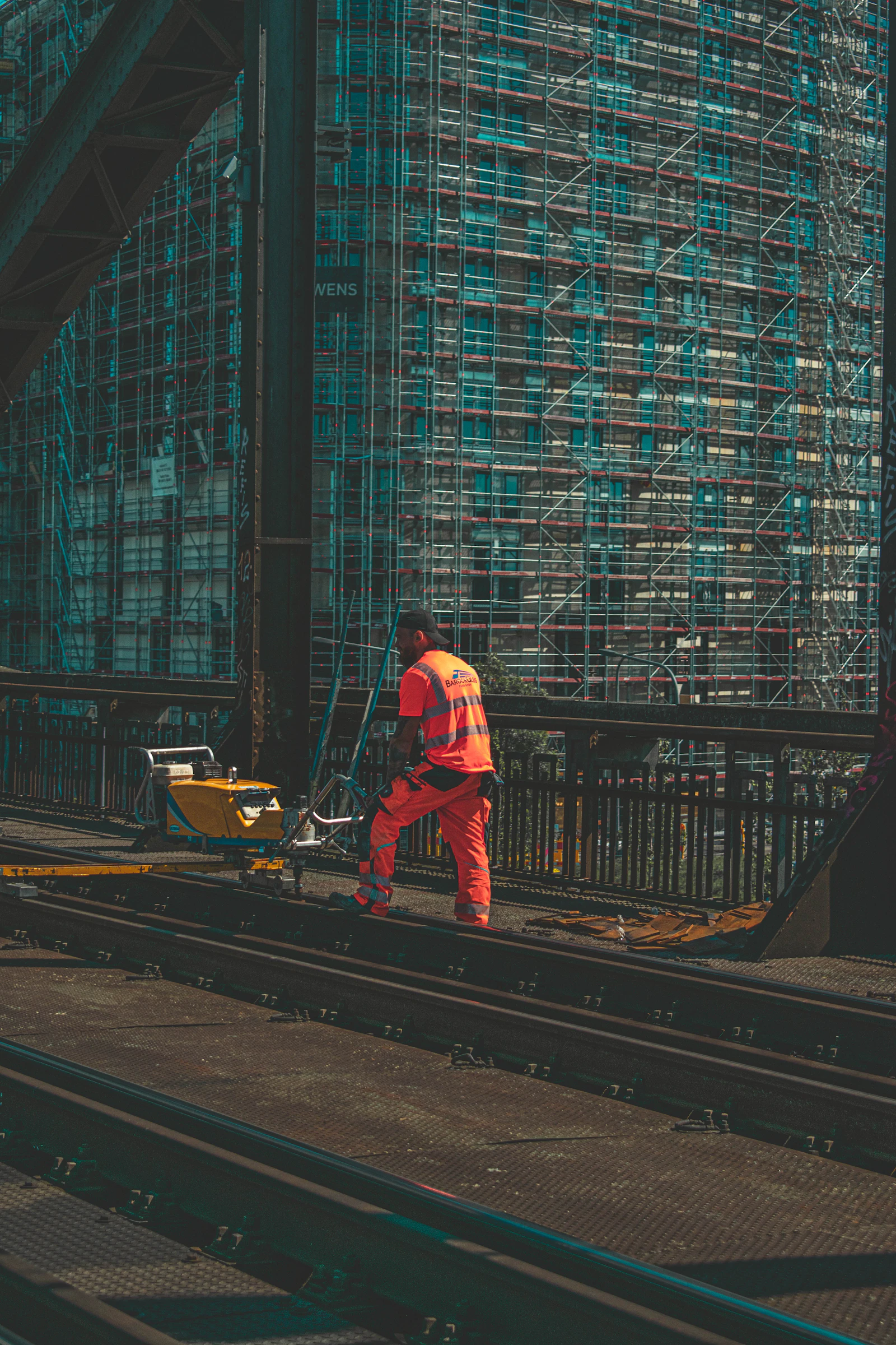 Worker in high-visibility clothing standing on the track
