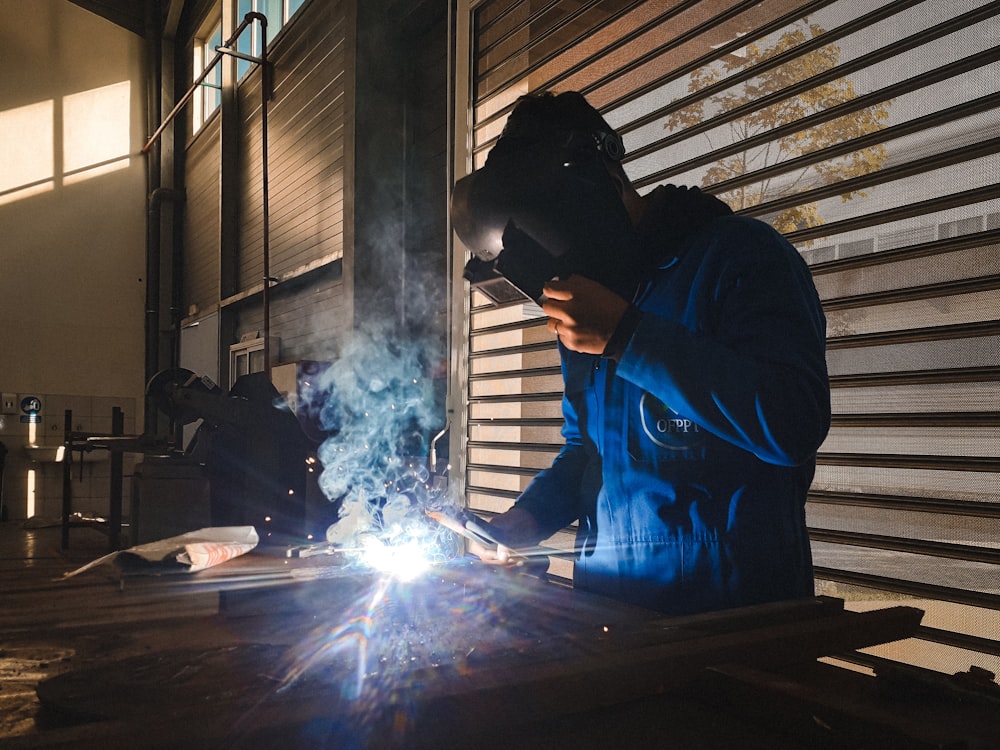 a welder working on a piece of metal