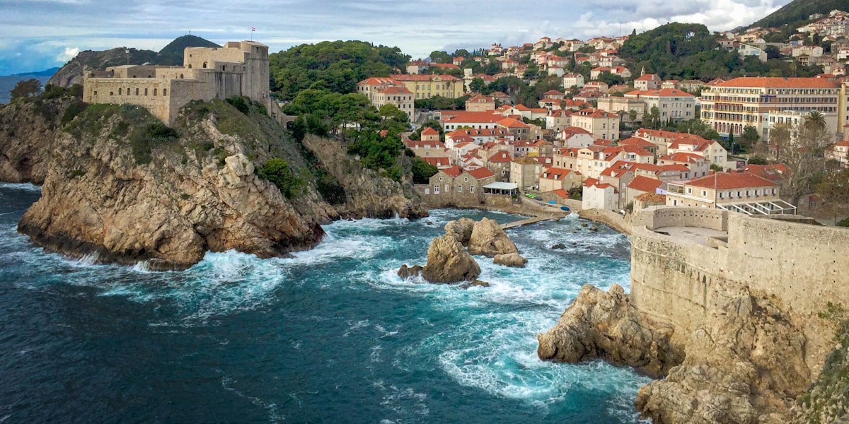 city buildings near body of water during daytime