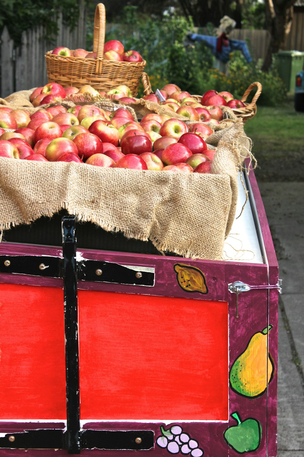 a truck filled with lots of red and green apples
