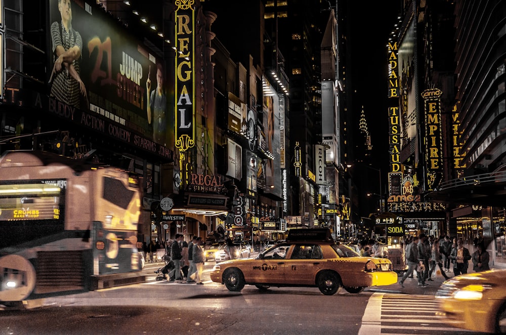 a city street filled with lots of traffic and tall buildings