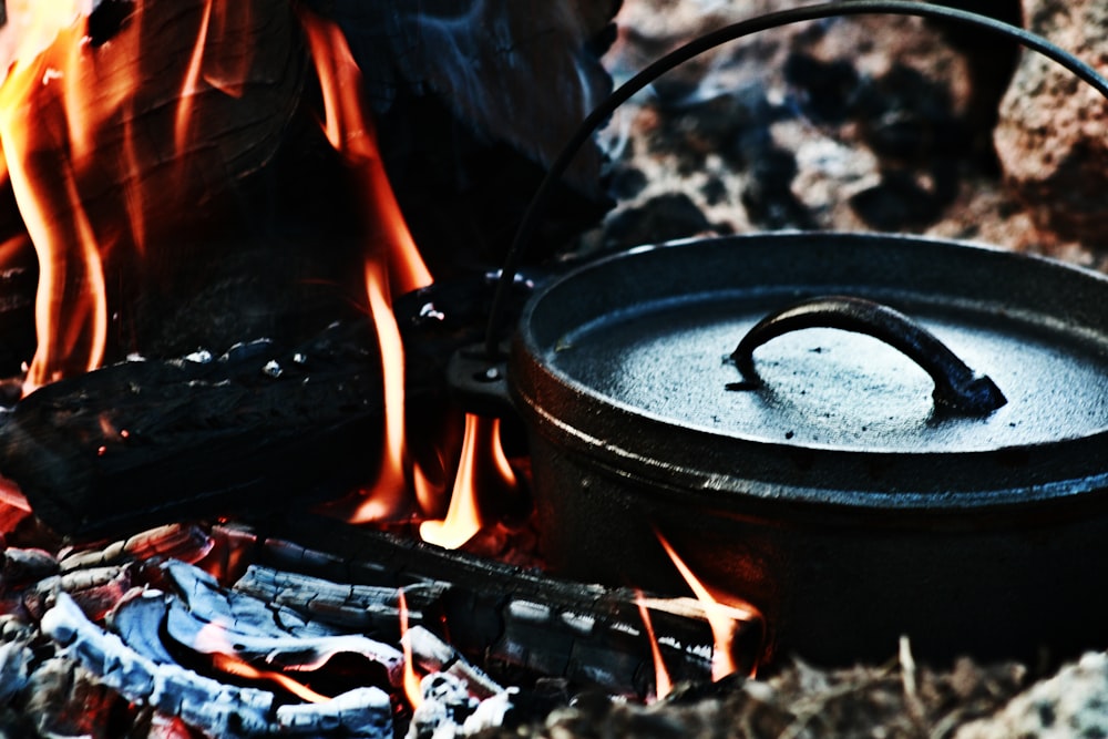 black round pot on fire