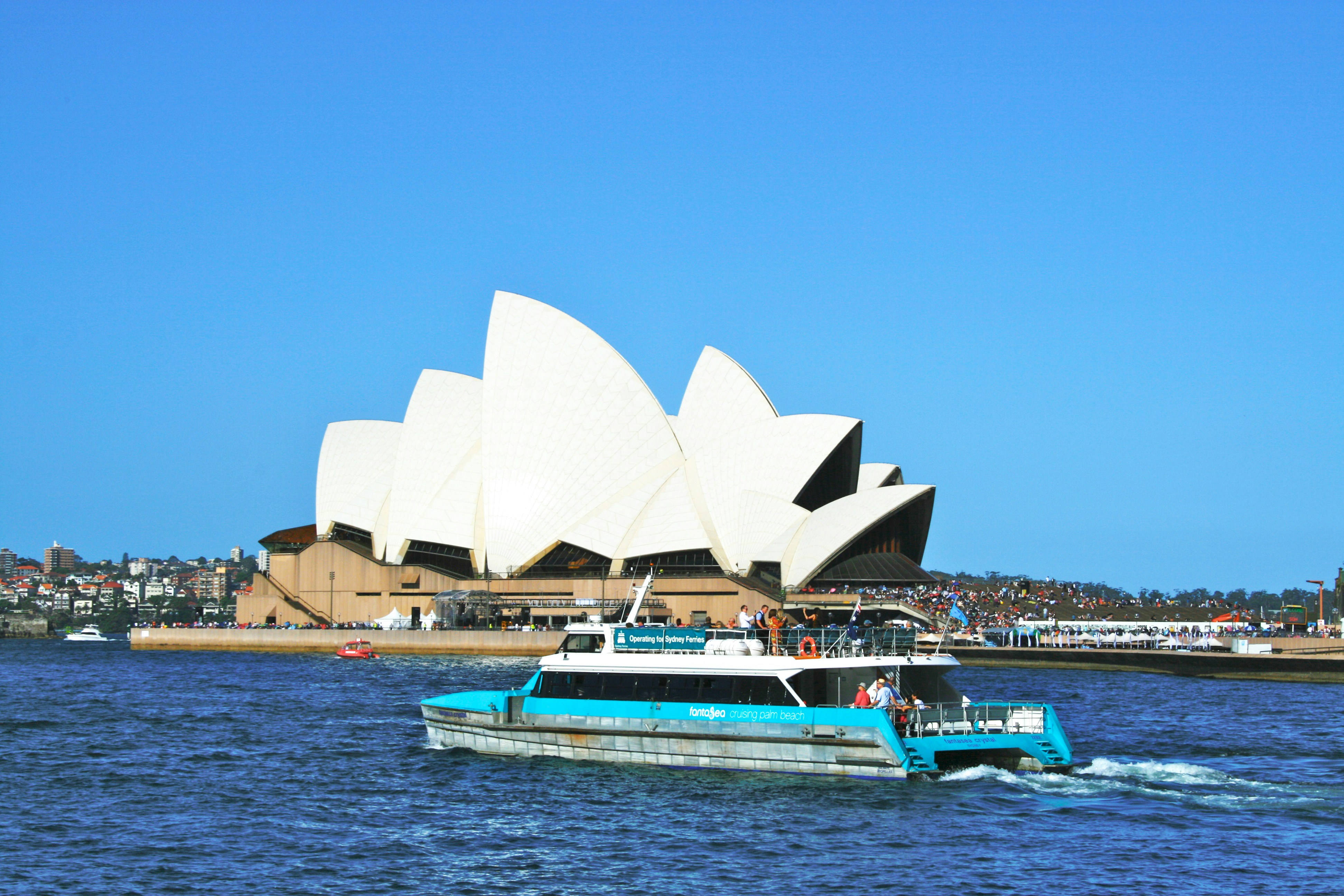 a boat in the water near a large building