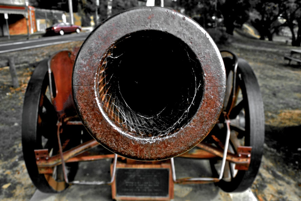 a large metal object sitting on top of a cement slab