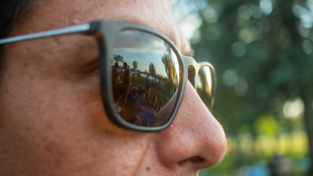 person wearing black framed sunglasses