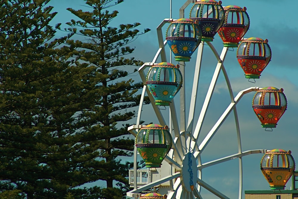 a ferris wheel with a clock tower in the background