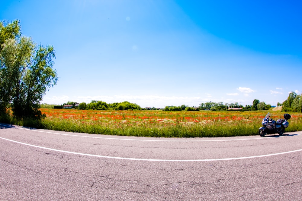 a motorcycle is parked on the side of the road