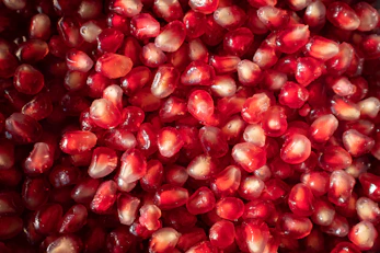 a bunch of pomegranates that are in a bowl