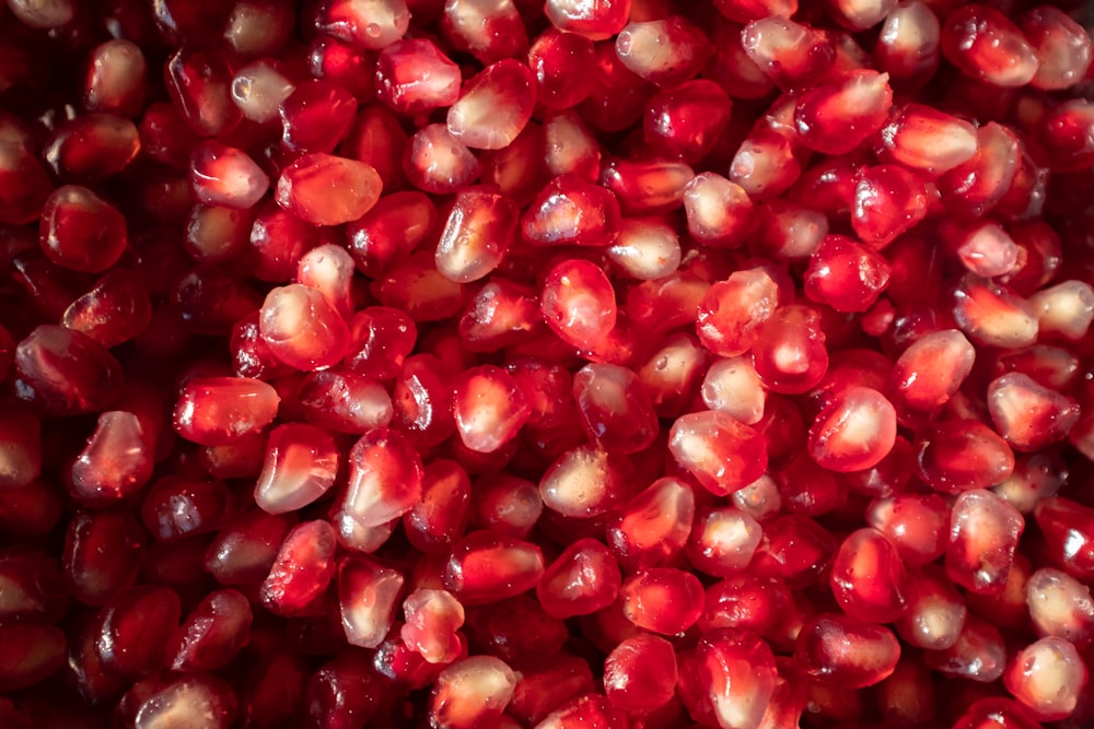 a bunch of pomegranates that are in a bowl