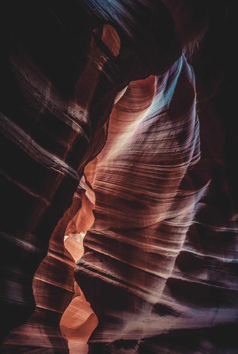 brown and black cave with light