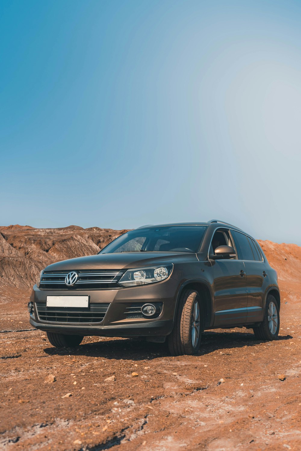 black mercedes benz suv on brown dirt road during daytime