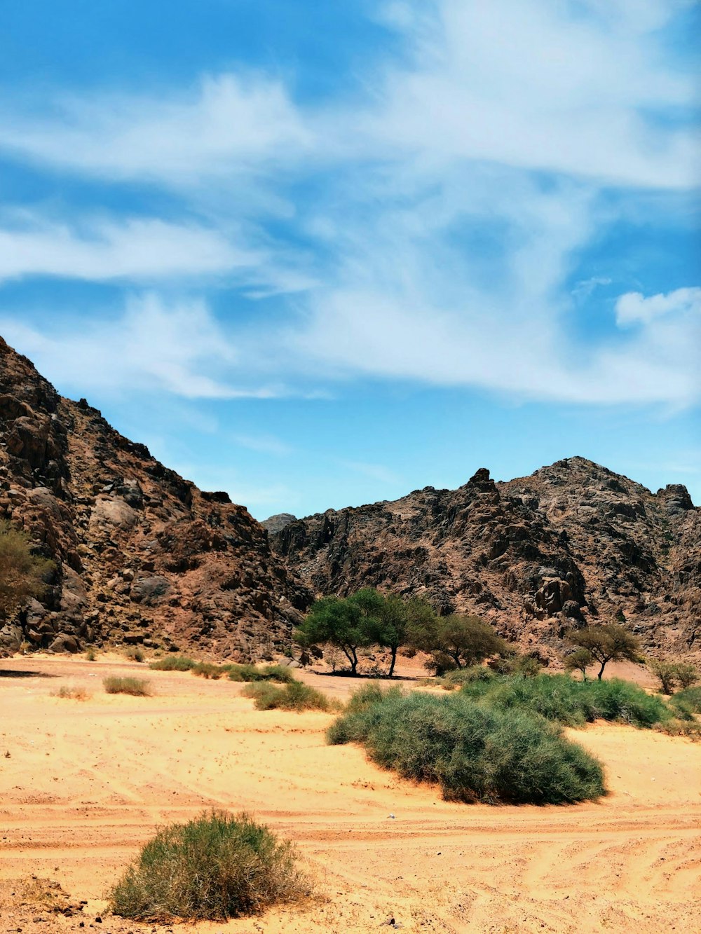 brown mountain under blue sky during daytime