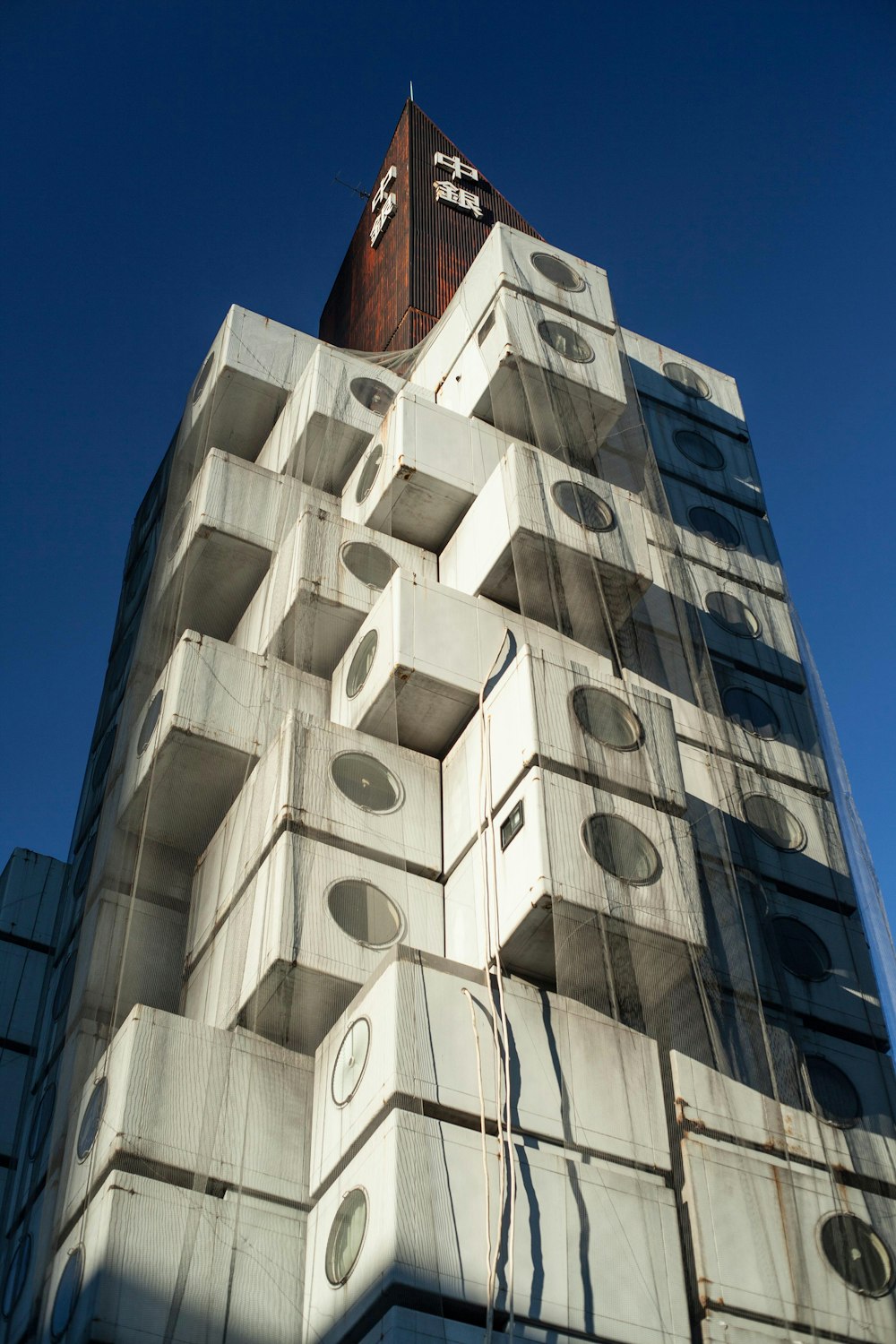 white concrete building under blue sky during daytime