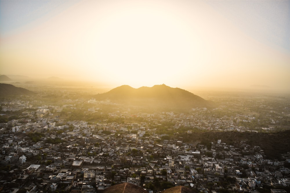 city buildings near mountain during daytime