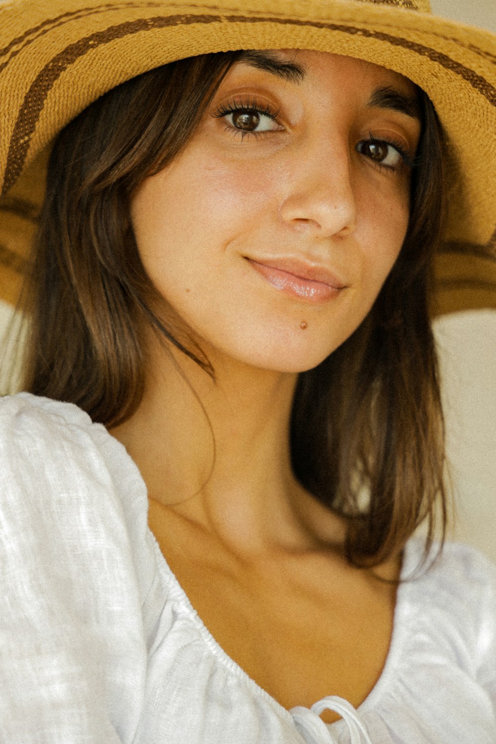 woman in white shirt smiling