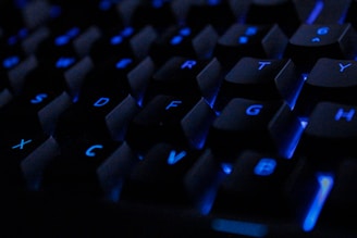 a close up of a keyboard with blue keys