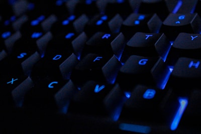a close up of a keyboard with blue keys