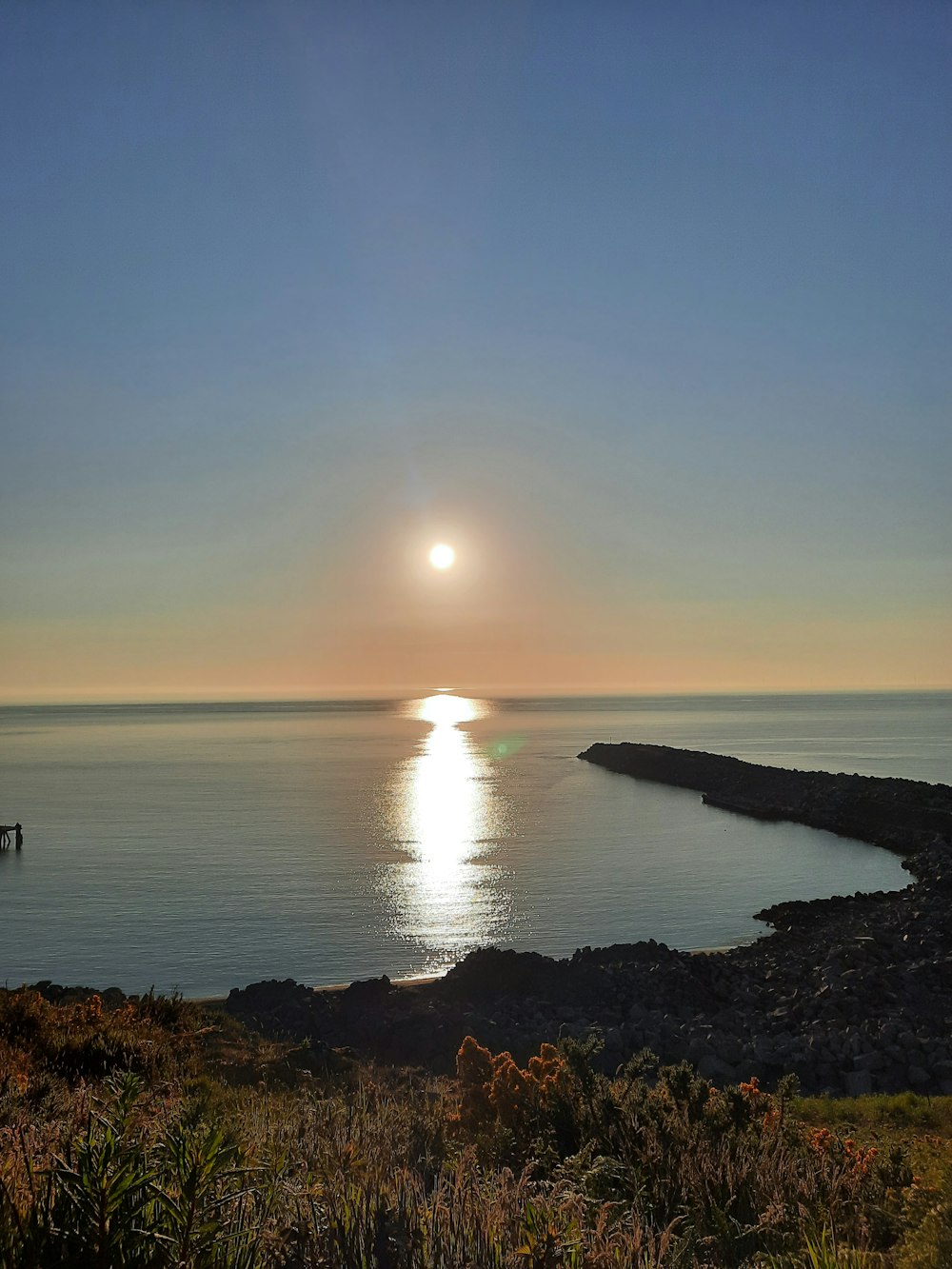 body of water during sunset