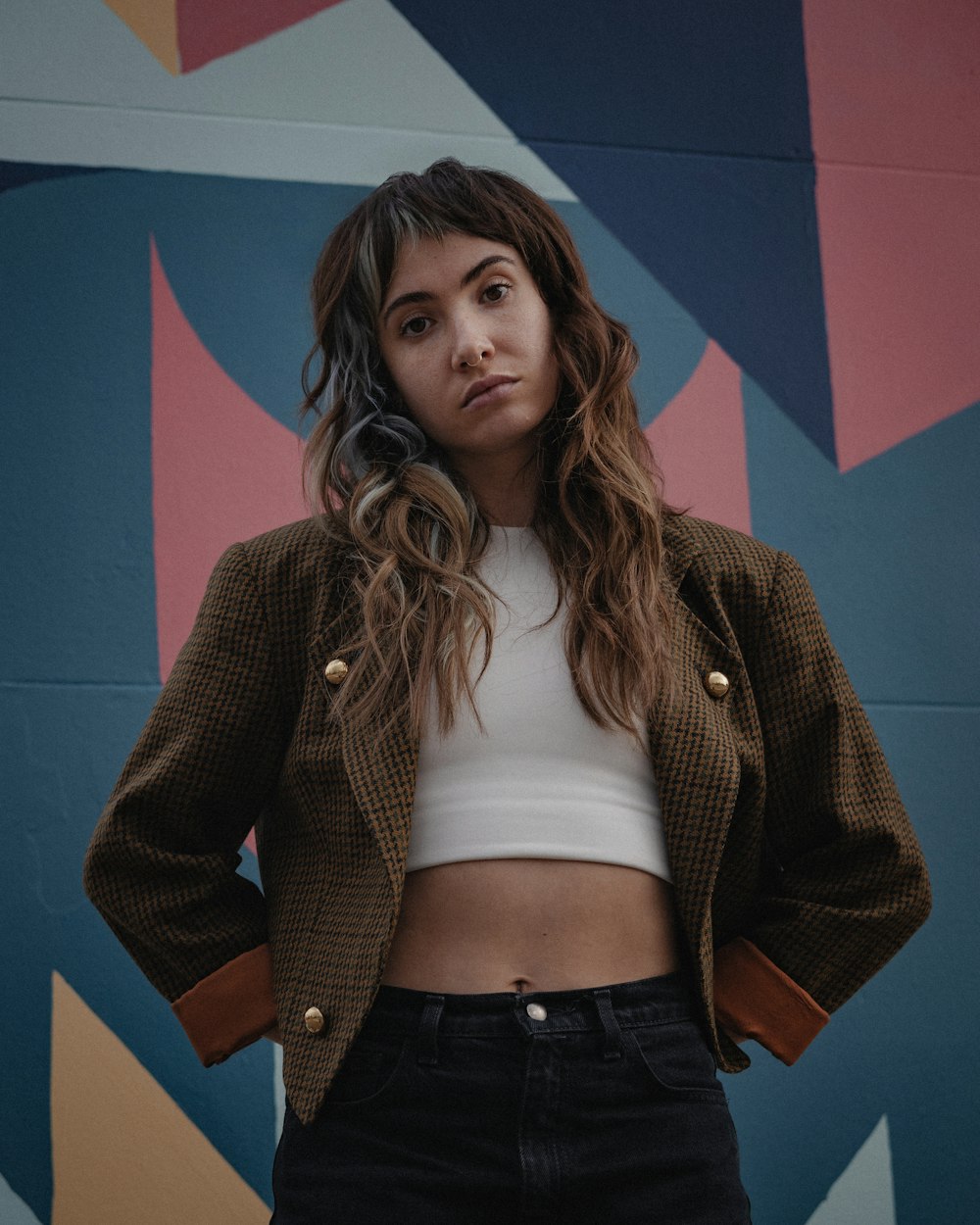 woman in brown cardigan standing