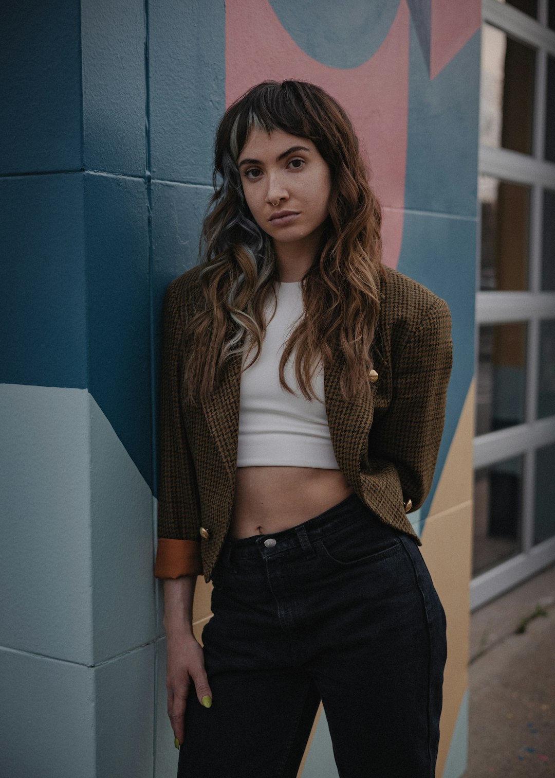 woman in brown cardigan and white shirt