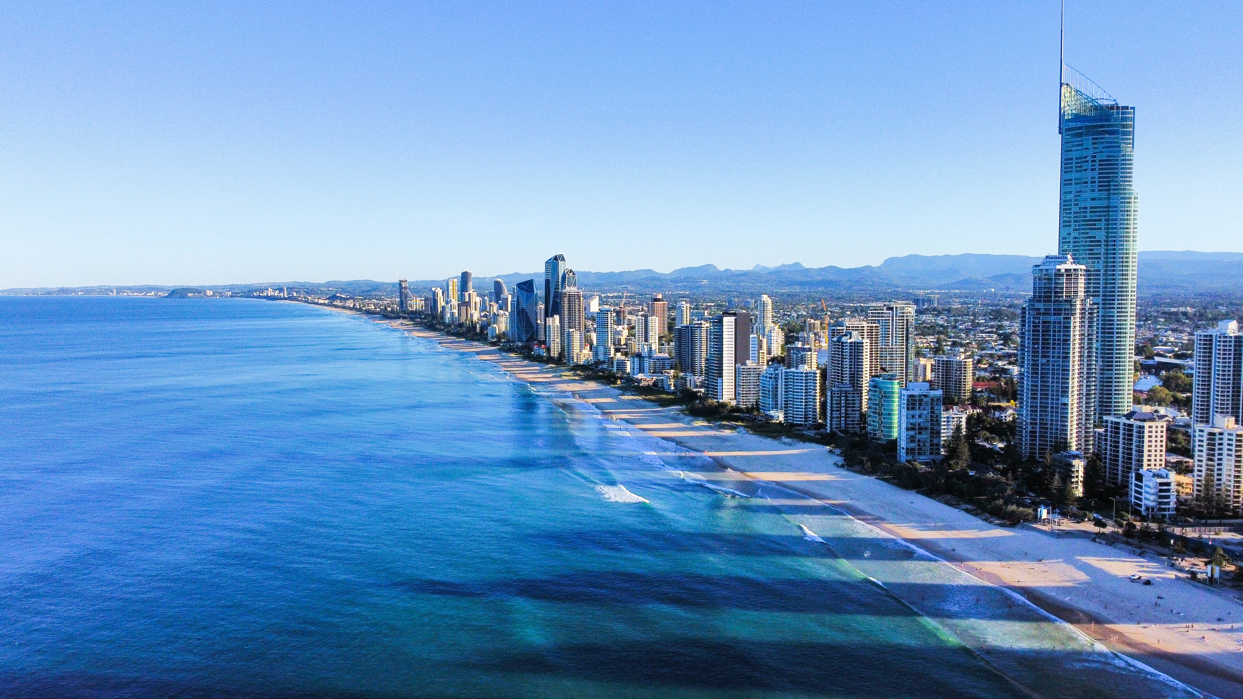city skyline across blue sea under blue sky during daytime