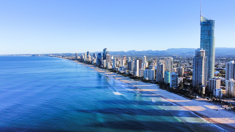 city skyline across blue sea under blue sky during daytime