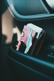 10 banknote on black leather wallet