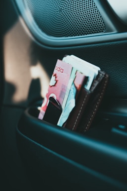 10 banknote on black leather wallet