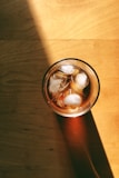 stainless steel can on brown wooden table