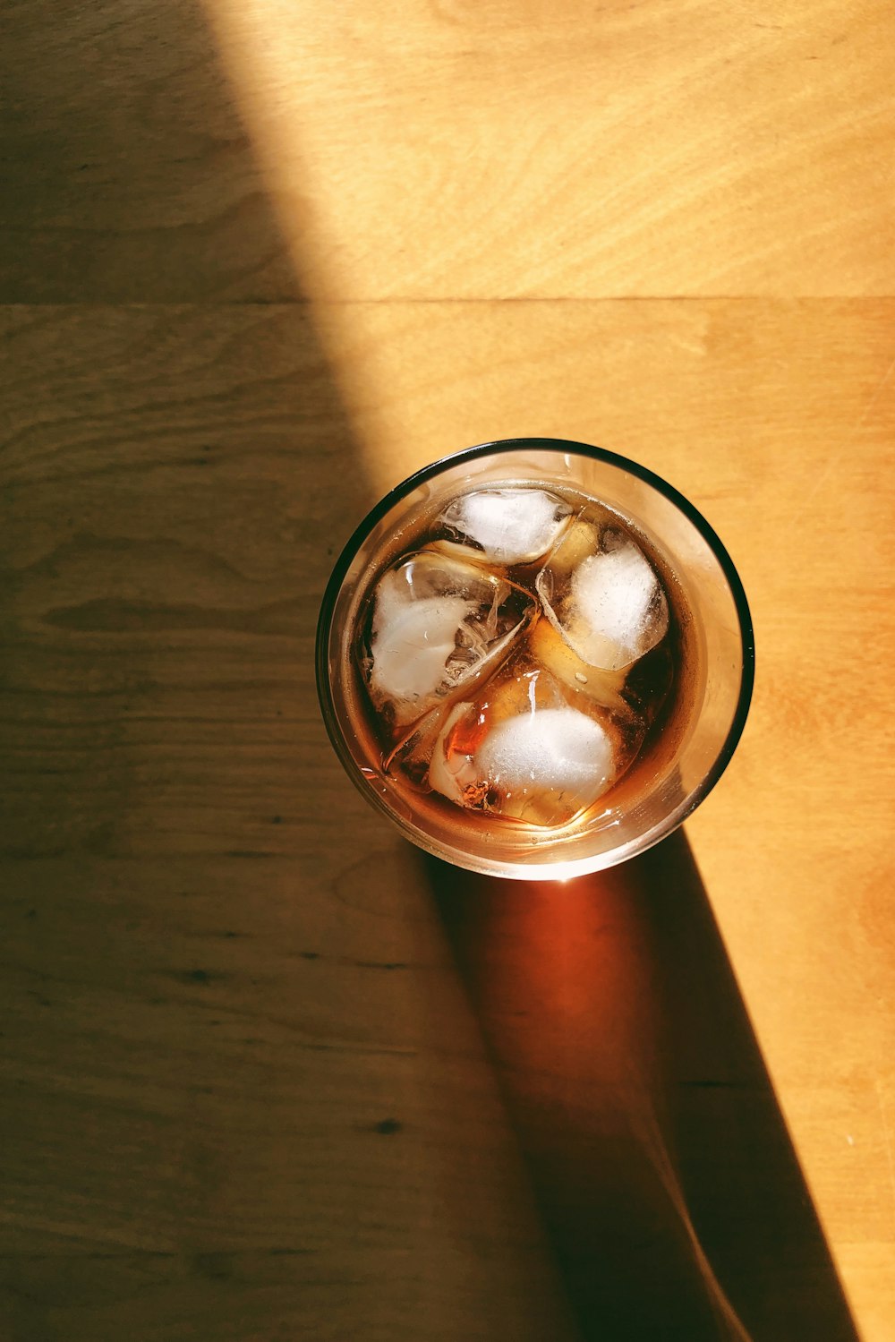 stainless steel can on brown wooden table