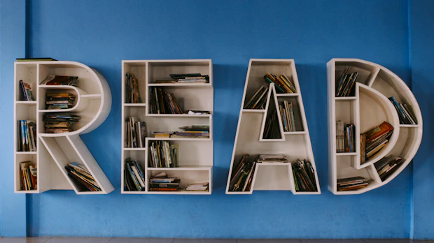 floating book shelf spelling out the word "READ"