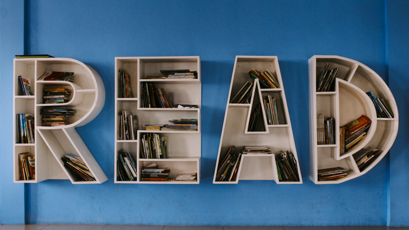 floating book shelf spelling out the word "READ"