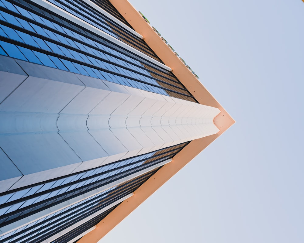 a tall building with a sky in the background