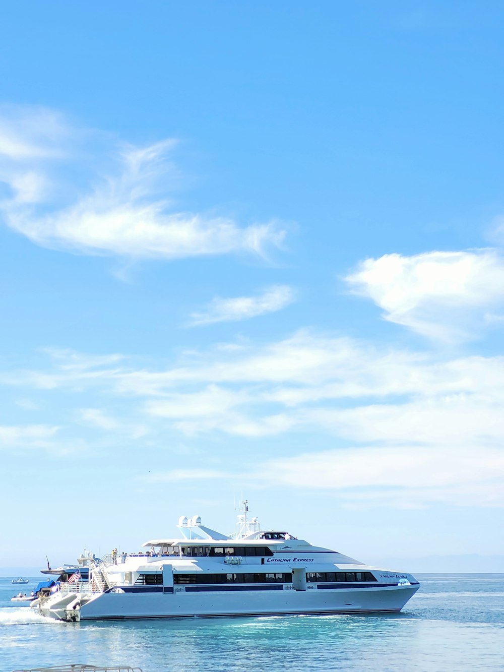 a large white boat floating on top of a body of water