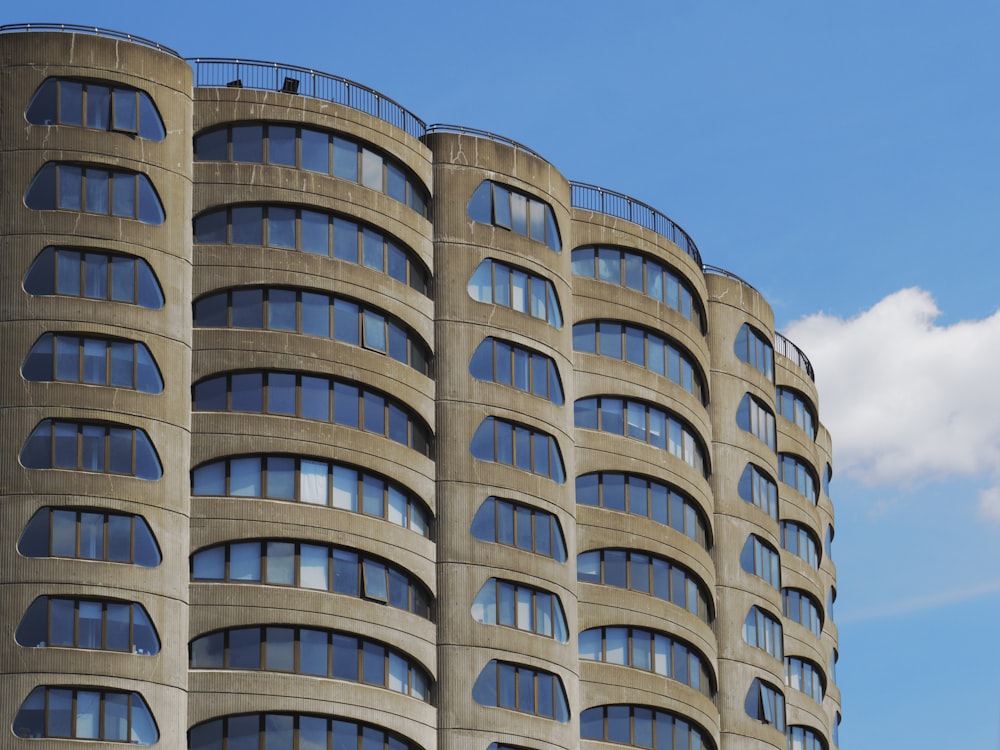 a very tall building with many windows and a clock