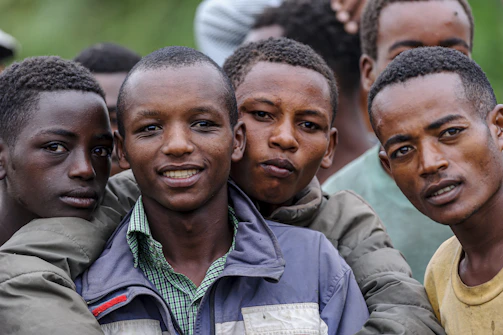 a group of young men standing next to each other