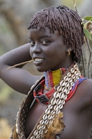 a woman with a stick in her mouth