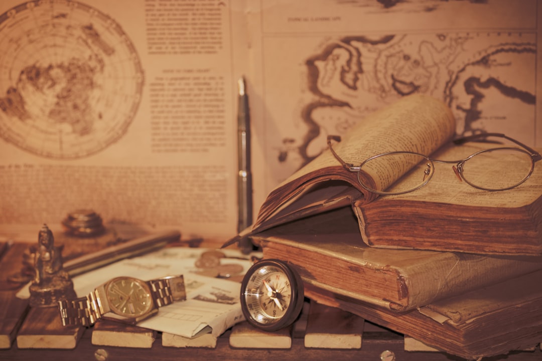 a stack of books and a watch on a table, Vintage vibes.....