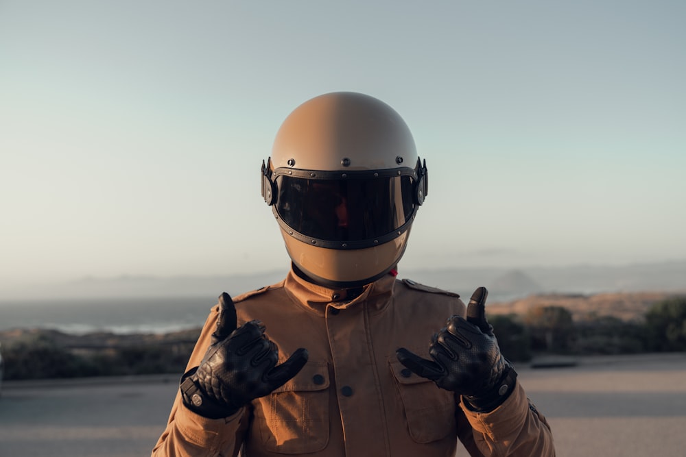 person in black jacket wearing white helmet