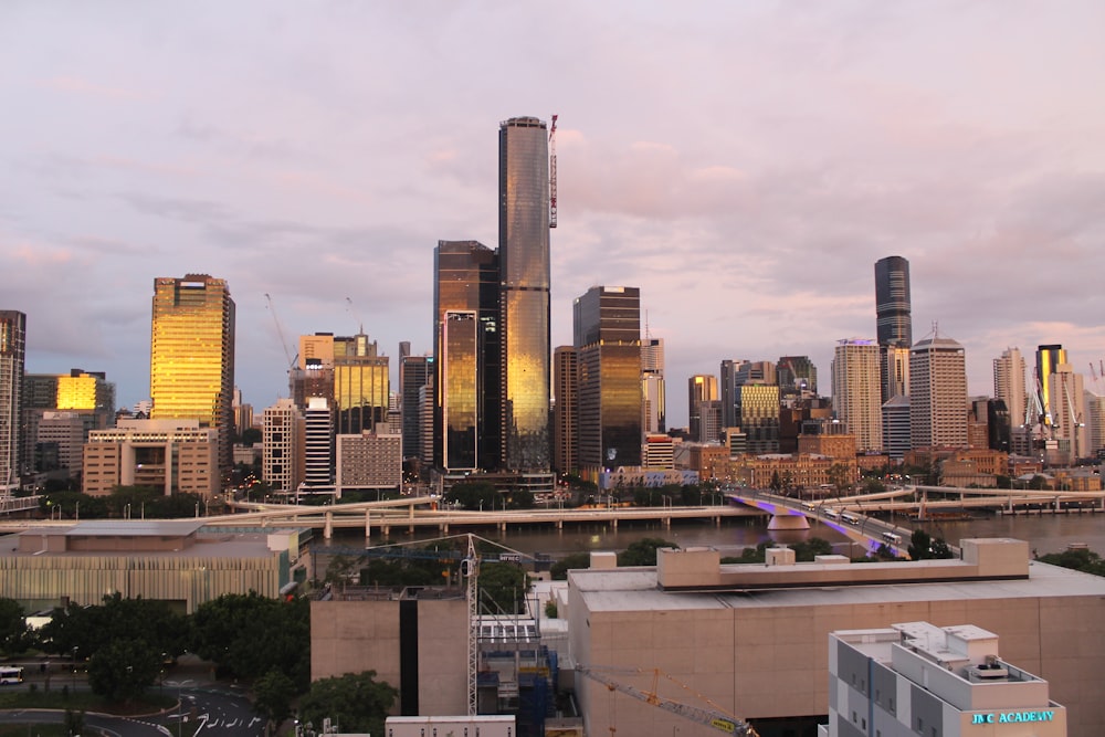 a view of a city with a bridge in the foreground