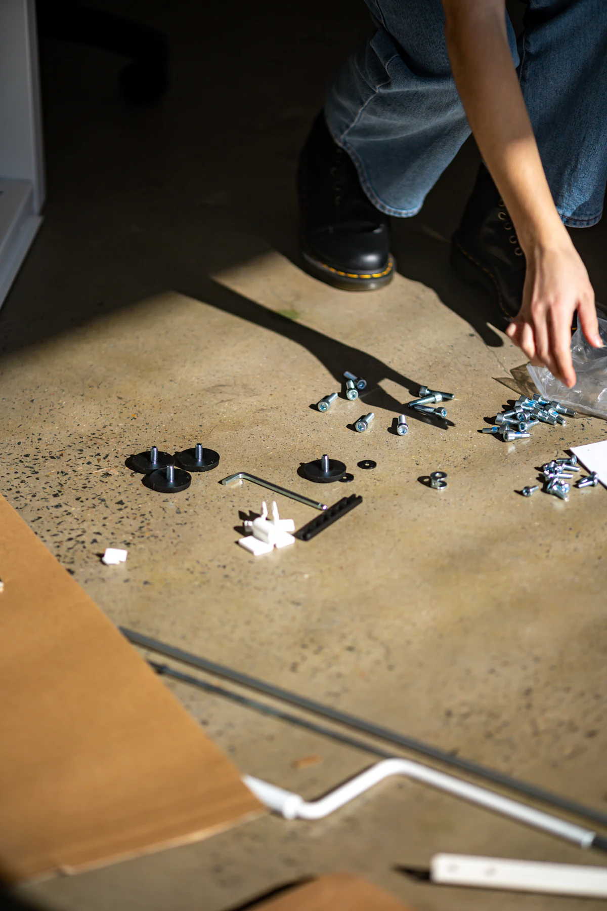 Flat-pack fittings and fixings laid out before assembly