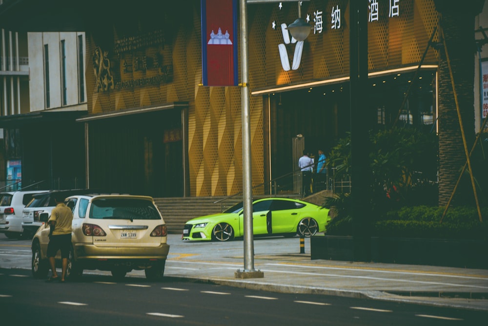 a yellow car parked on the side of the road