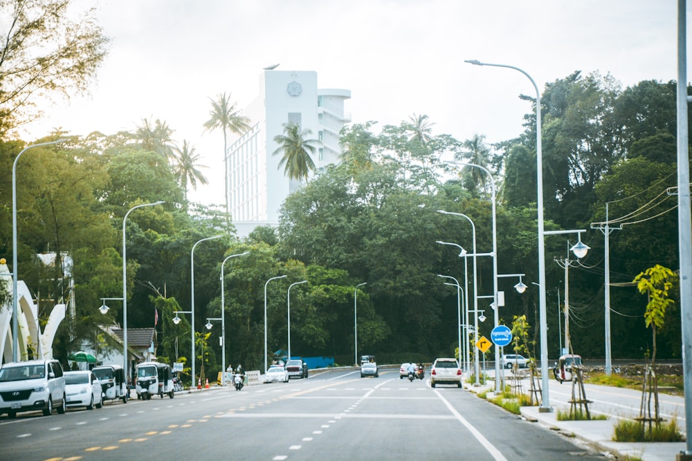 a street filled with lots of traffic next to tall buildings