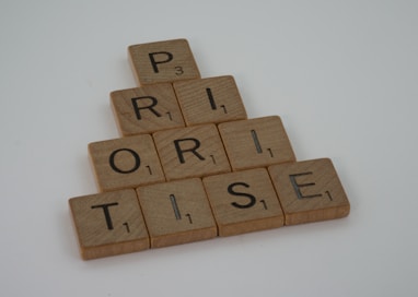 a scrabbled wooden block spelling the word prize