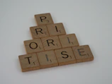a scrabbled wooden block spelling the word prize