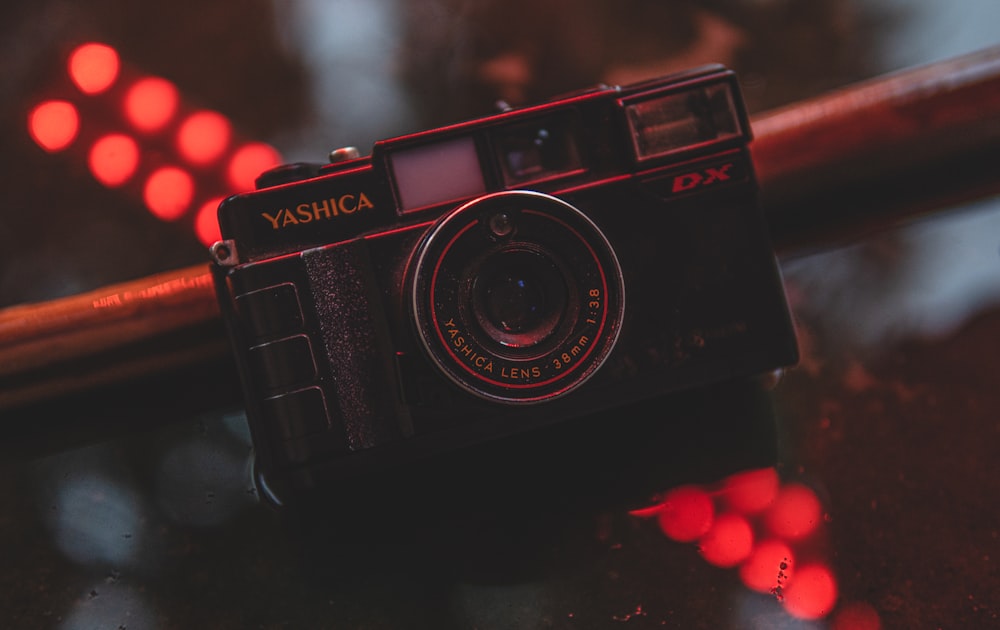 a black camera sitting on top of a table