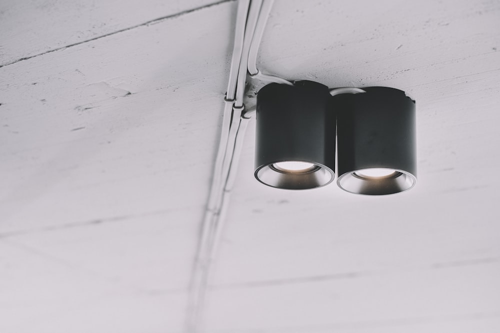 a couple of lights that are on a ceiling