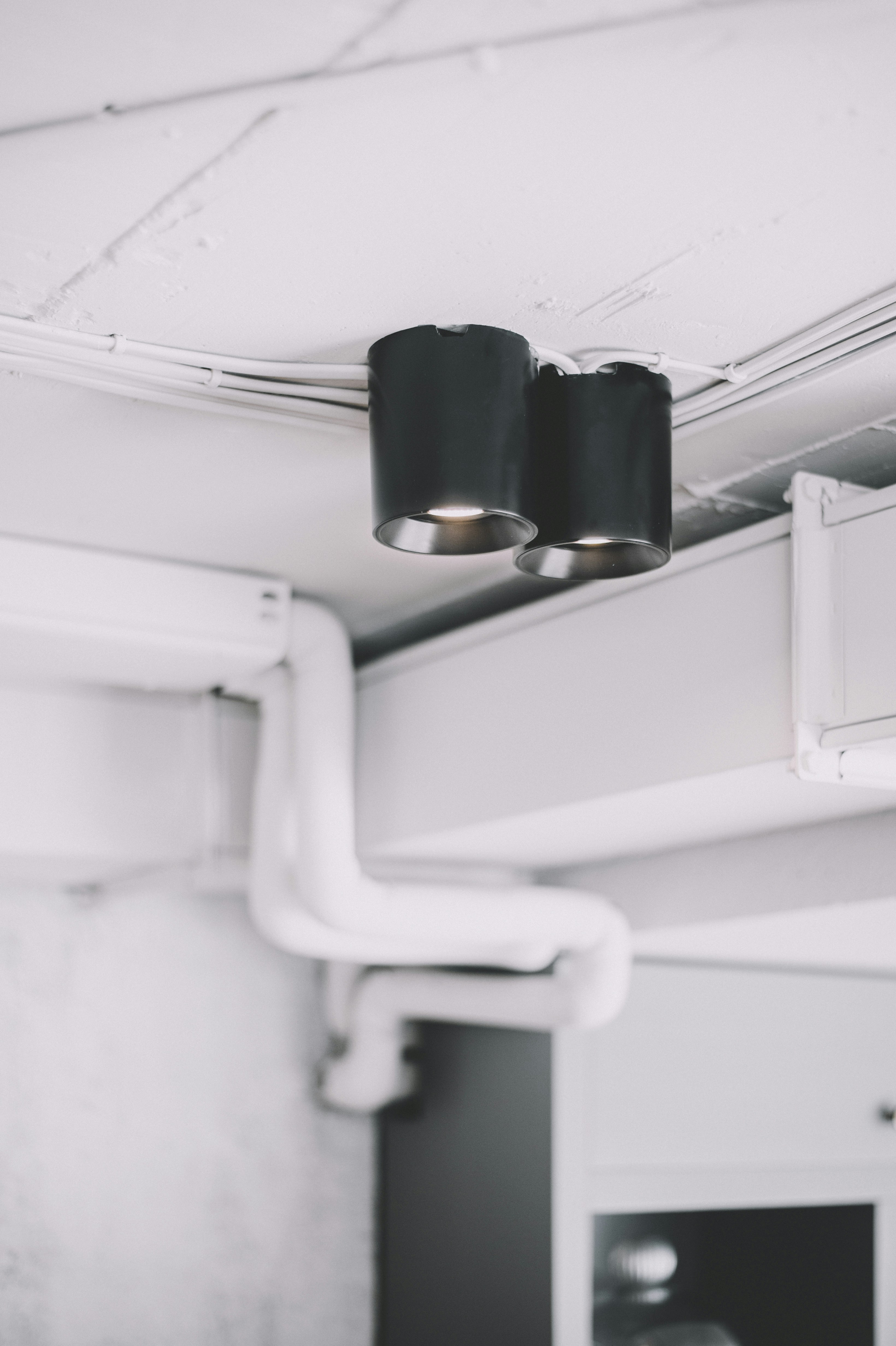 a couple of lights that are on a ceiling